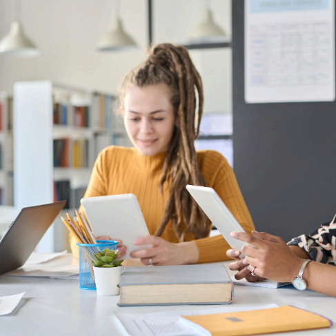 A student reviews a translated transcript on a laptop as Charlotte Translation Services ensures academic terms stay clear.