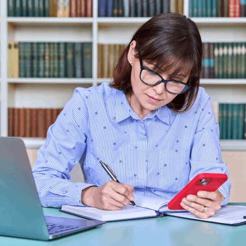 A university staff member checks a translated academic diploma packet prepared with Oklahoma City Translation Services.