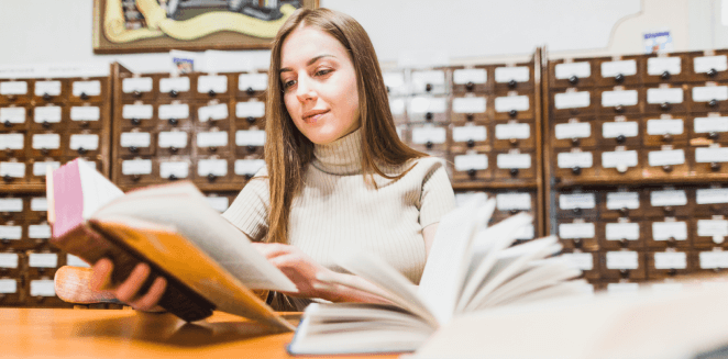 A professional translator working on an academic document, surrounded by books and materials in San Francisco. A professional translator working on an academic document, surrounded by books and materials in San Francisco.