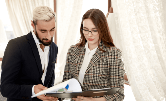 Translator reviewing a legal contract document, ensuring accurate translation for business communication.