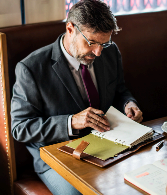 A property manager checks a lease for an overseas tenant, using Agreement Translation Services to confirm dates and payments.