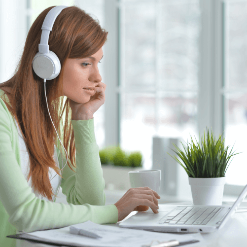 Professional working on a laptop, showcasing expertise in audio and video translation services tailored for global needs.