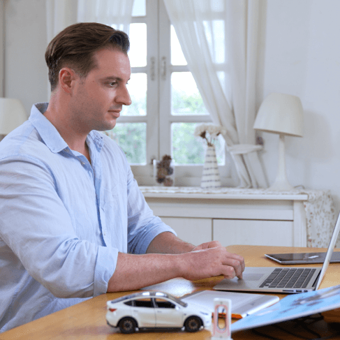A translator working on a automotive, illustrating trusted translation services for technical automotive manuals. A translator working on a automotive, illustrating trusted translation services for technical automotive manuals.