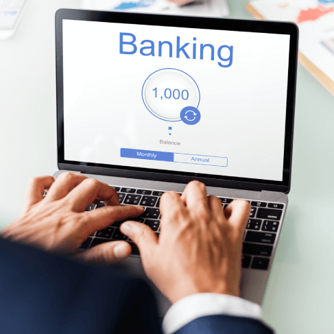 An experts using online banking on a tablet, emphasizing certified banking translation services for finance industries.