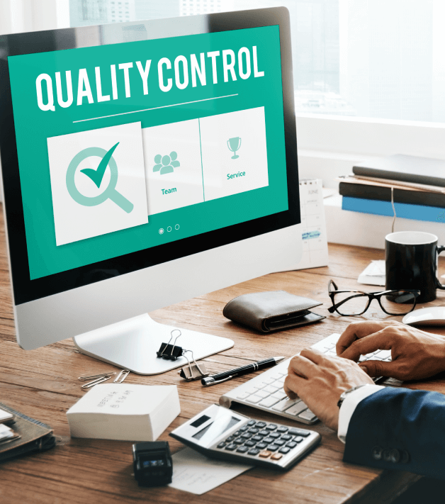 A translator works on a computer displaying a 'Quality Control', embodying the standards of a Houston Translation Agency,