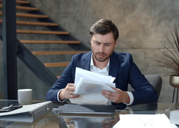 A translator highlights spelling and document numbers for client approval, supporting certified Ames Translation Services.