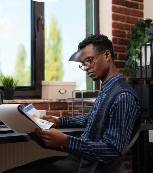 Professional translator working on brochure translation services that seamlessly adapt to brochure design types.