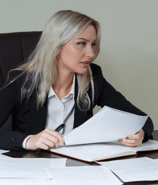 In a conference room, counsel reviews a supplier deal as Contract Translation Services support business due diligence.