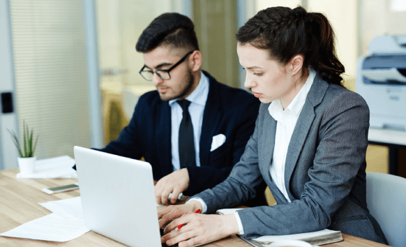 Professionals collaborating business translation services for seamless communication and organizational growth.