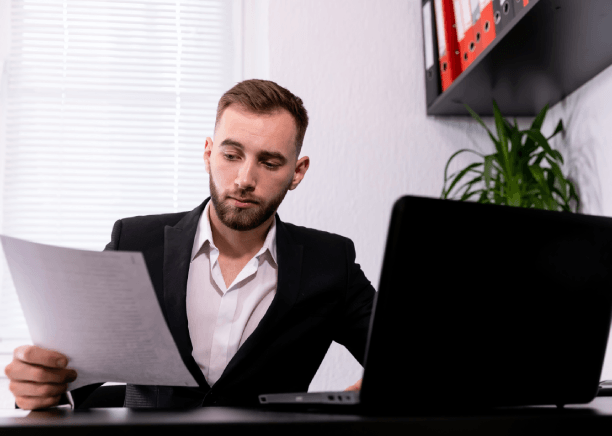 A translator checks CAD-export callouts as Heavy Equipment Translation Services protect serial codes from translation edits.