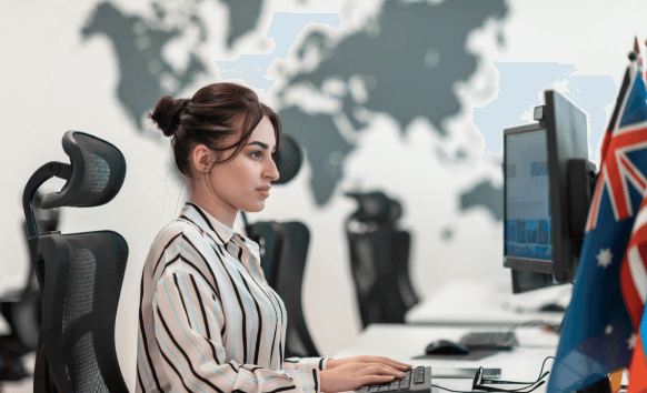 A translator working on a desktop in Calgary, showcasing Calgary translation services for business needs.