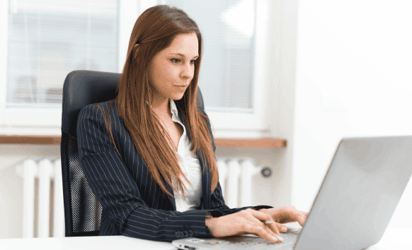 A professional translator working on legal documents, emphasizing Calgary’s precise legal translation services.