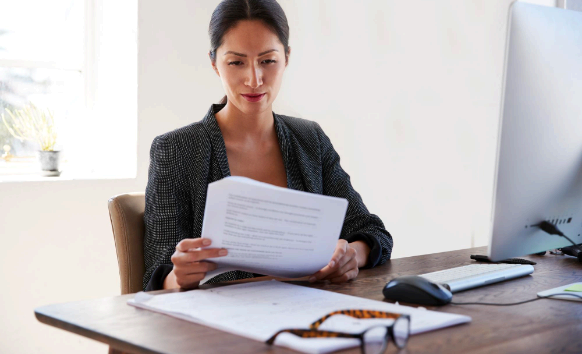 A client reviews a USCIS-ready certified translation, highlighting Charlotte Translation Services for certified document.