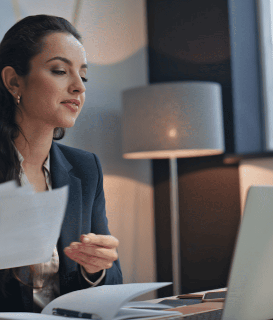 A certified French-to-English translator working on a document to ensure accurate translation and meaning.