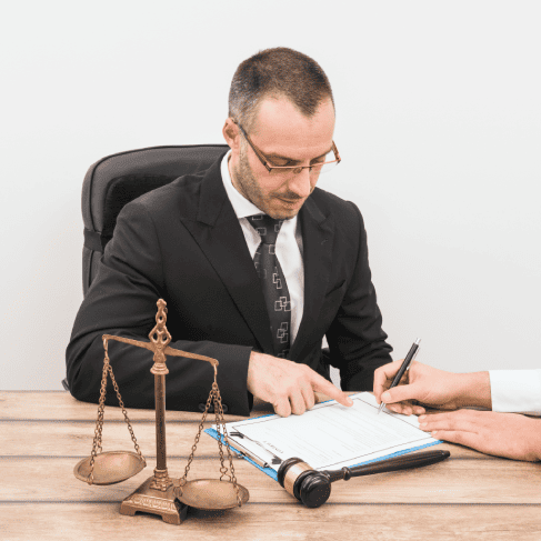 A legal translator reviewing family documents, ensuring accuracy and confidentiality in legal translation services.