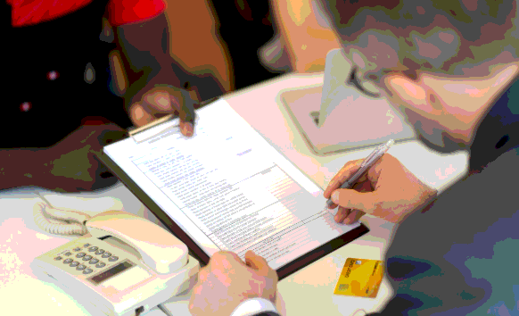 A translator formats a certified document packet as Memphis Translation Services follows agency-ready layout rules.
