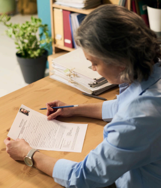 A client reviews a certified document translation packet and checks formatting rules for official submissions at Minneapolis.