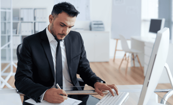 Professional working on a legal document, highlighting certified translation services for accurate agreement translations.