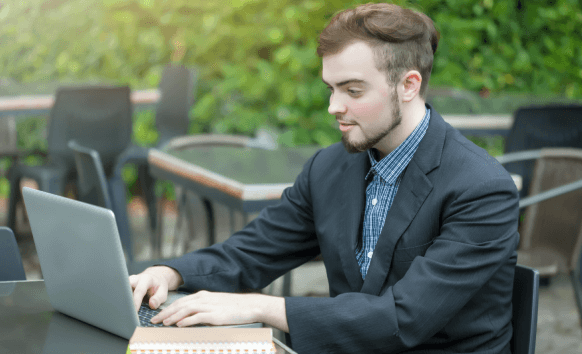 Expert working on a laptop, representing accurate translation services tailored for Charlotte based businesses.