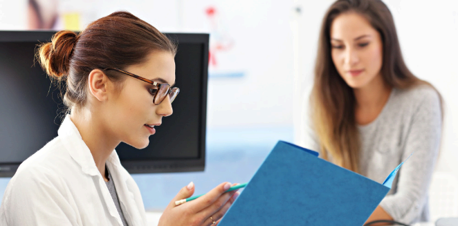 A coordinator updates translated patient consent forms using Life Science Translation Services for a clinical study site.
