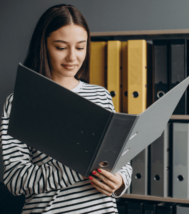 Expert reviewing confidential documents, showcasing different types of secure document translation services.