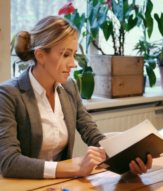 An attorney reviews a bilingual contract draft while Charlotte Translation Services delivers precise legal document.