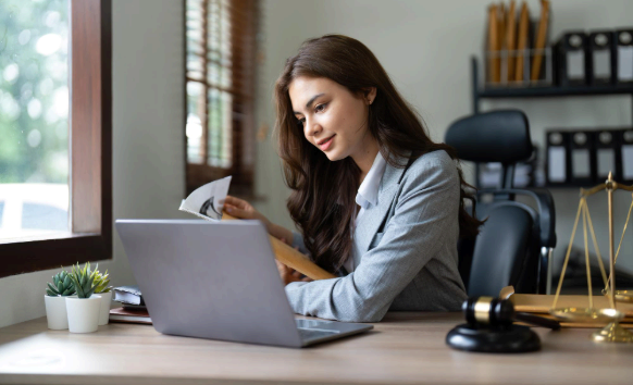 A paralegal checks a translated court filing as Language Translation Services keep legal wording consistent and secure.