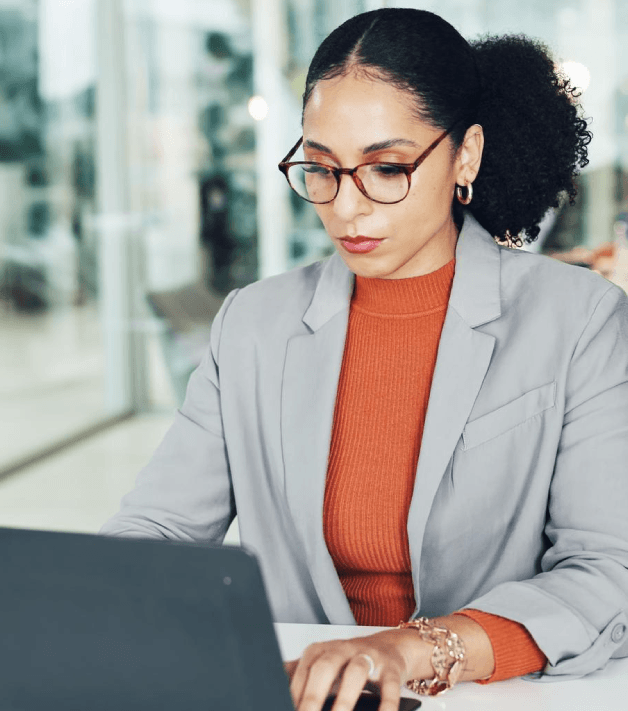 A reviewer cross-checks license numbers and credentials in Business Card Translation Services before approving a final proof.