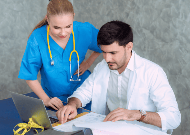 Dentists reviewing a document, symbolizing the importance of cultural adaptation in medical document translations.