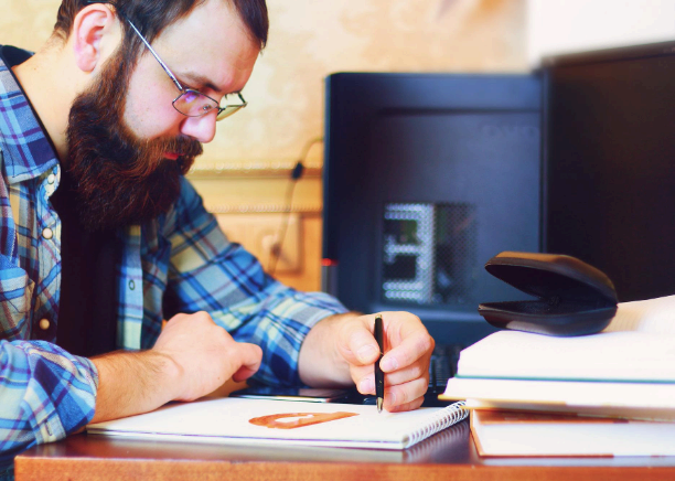 A translator aligns diagram callouts and safety steps as Hebrew Translation Services prepare technical manual pages.