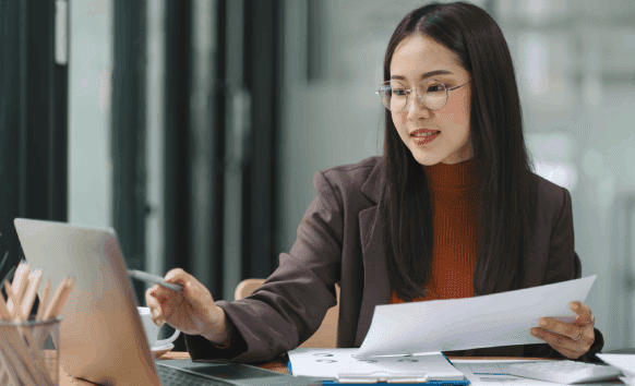 Translator working on immigration documents, showcasing reliable and accurate document translation services in Charlotte.