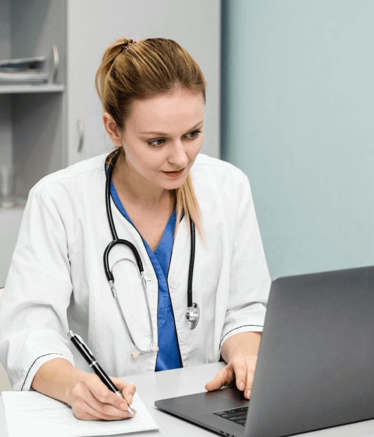 A professional working on translated materials, enhancing global reach in healthcare,  and  e-learning translation services.