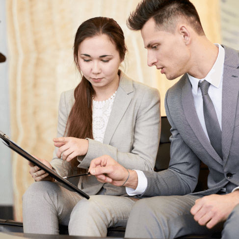 Expert reviewing translated benefits package to better understand insurance and retirement options in their native language.