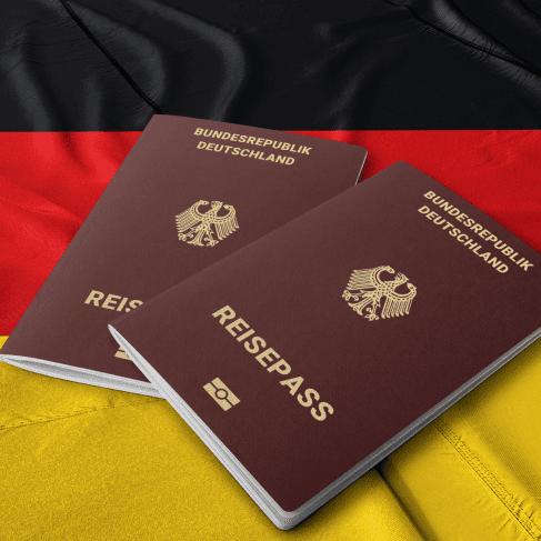 A German passport placed on a country flag, ensuring accurate and professional English-to-German passport translation services.