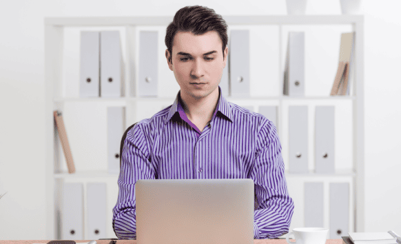 A professional works on Insurance translation services, helping customers receive precisely translated policies.