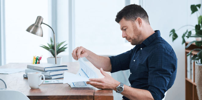 A translator reviews documents to ensure fast turnaround for brochure translations without compromising the quality.