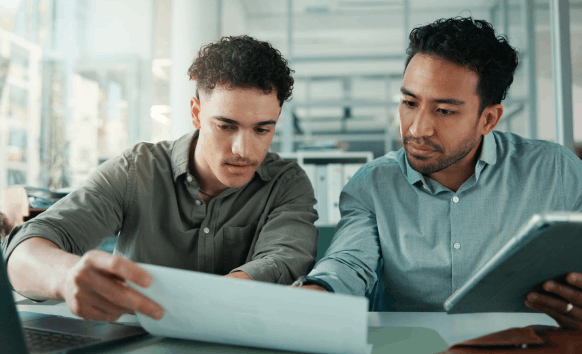 A contractor reviews professional files while Oklahoma City Translation Services translates invoices and license records.