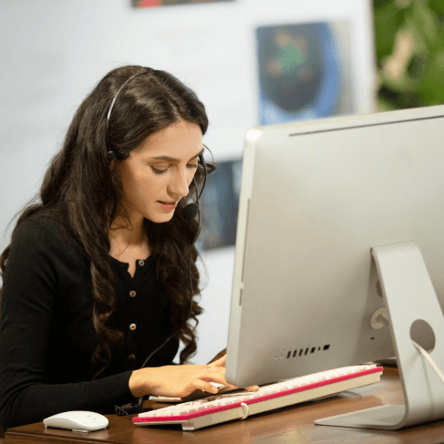 An HR lead compares handbook pages as Ebook Translation Services adapt business training content for global teams.