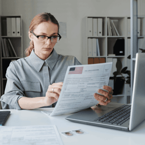 Immigration professional examining documents, offering hassle-free translation services in Charlotte for visa processing.