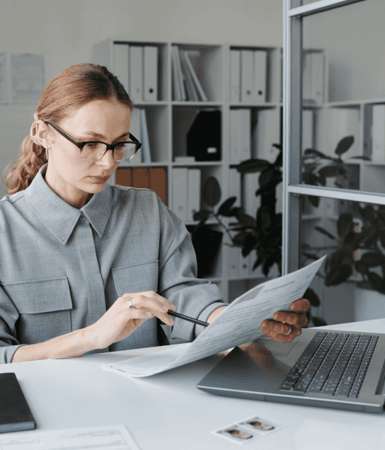 A woman reviewing visa application, showcasing trusted immigration document translation services in Calgary for legal needs.