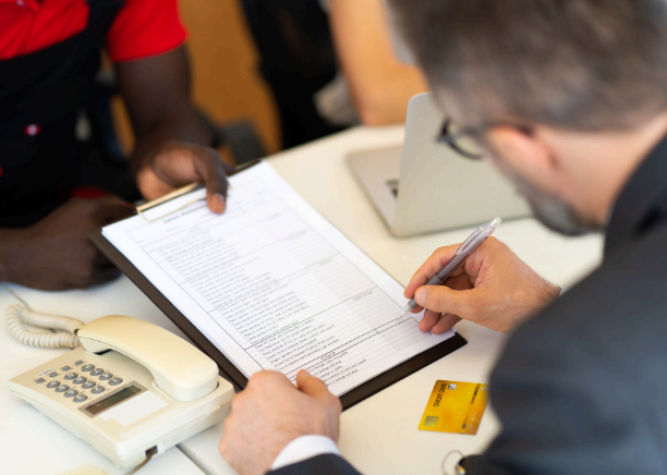 A translator formats a birth certificate as Minneapolis Translation Services completes immigration translation for USCIS.