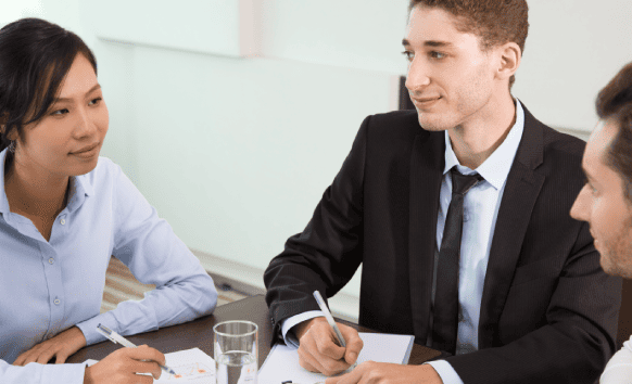 A legal team reviewing contracts translated through corporate translation services. A legal team reviewing contracts translated through corporate translation services.