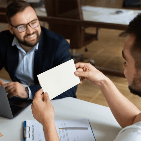 A startup team reviews translated titles with Business Card Translation Services to fit an industry-specific card layout.