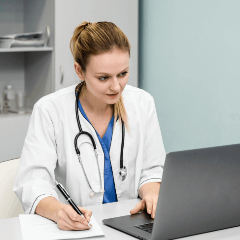 A doctor checks a medical terminology glossary, using New York Translation Services for industry-specific accuracy.