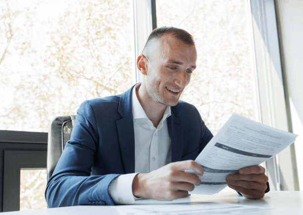 A manager reviews a bilingual export contract as Oklahoma City Translation Services prepares international business.