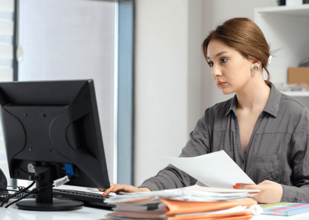 Professional working with documents, emphasizing the importance of lease document translation for different cultural contexts