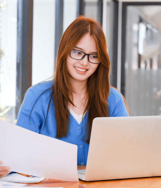 Women working on a laptop symbolized the need for accurate online lease document translation for legal purposes.