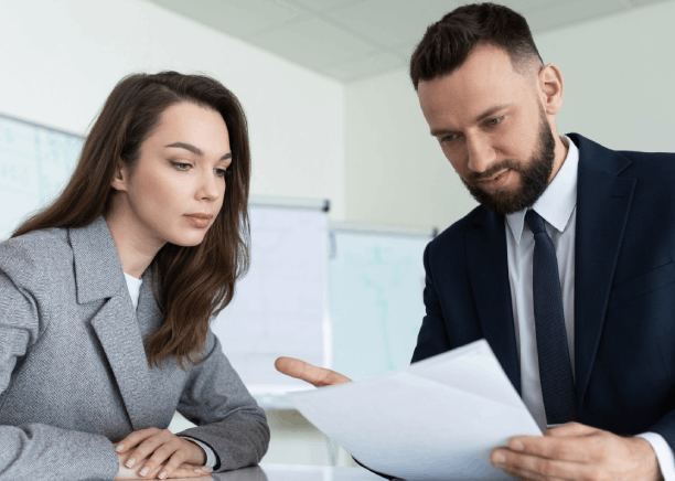 Two translators compare a contract translation side by side, using New York Translation Services for legal accuracy.