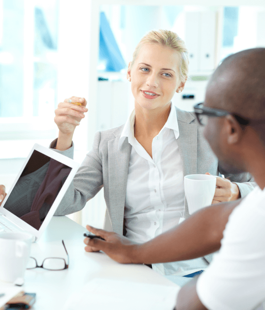 Certified translators in Boston discussing medical documents in a professional setting.