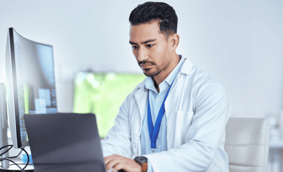 A doctor reviewing global health information from medical translation services trusted by healthcare providers for accuracy.